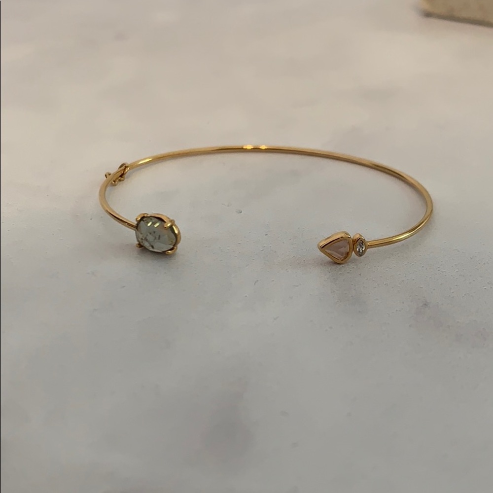 Delicate asymmetrical open cuff with stones